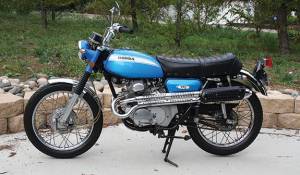 blue Honda 175 motorcycle