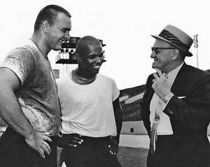 Dick Butkus, Gale Sayers and George Halas chat after football practice