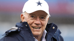 Jerry Jones in white cap with star