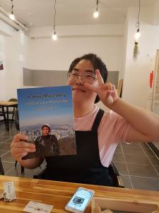 Choi Yunjoo holding A Seoul Miscellany