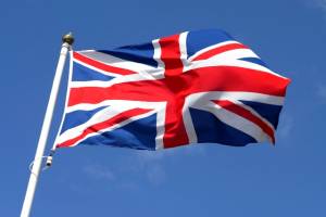 Union Jack flying on blue background