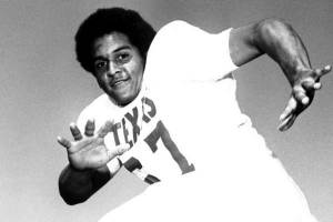 Julius Whittier posing in white UT football uniform