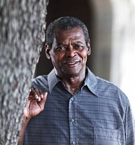 John Paul McCrumbly standing next to a tree