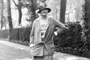 Coco Chanel standing with arm on her hip