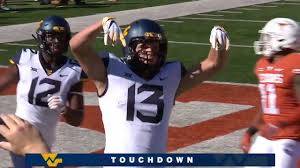West Virginia football player does Horns down