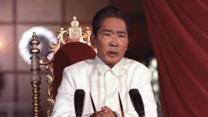 Ferdinand Marcos behind microphones