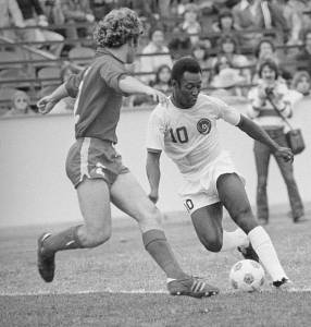 Neil Cohen defends against Pele in soccer match